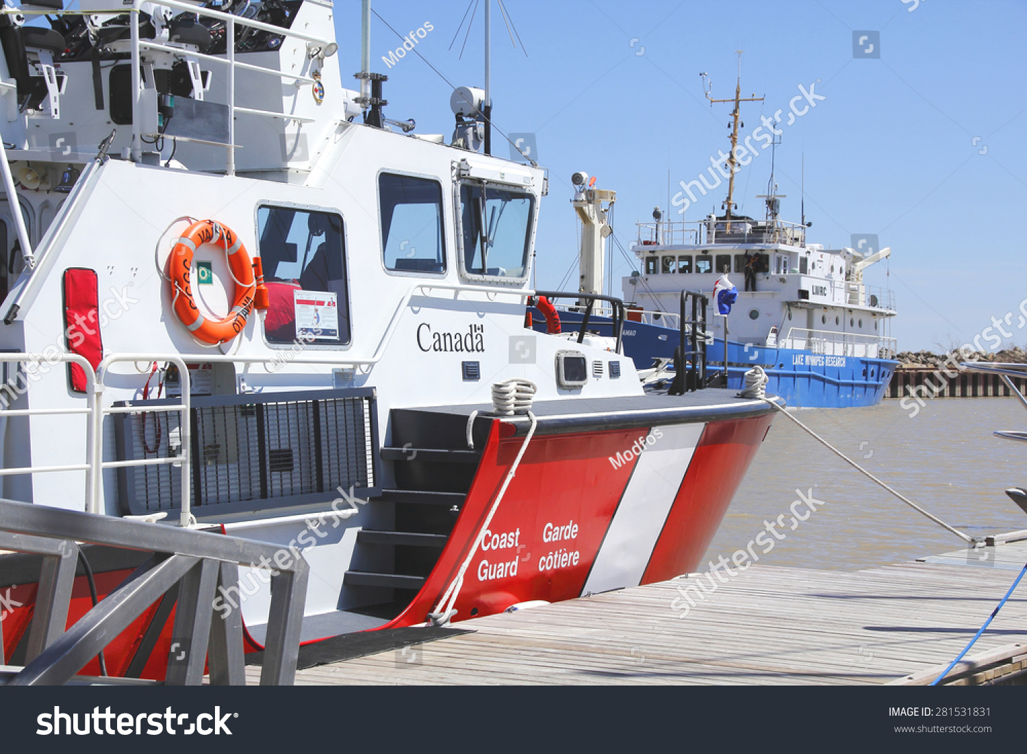 stock-photo-gimli-manitoba-canada-may-a-canadian-coast-guard-vessel-docked-in-the-gimli-manitoba-281531831.jpg